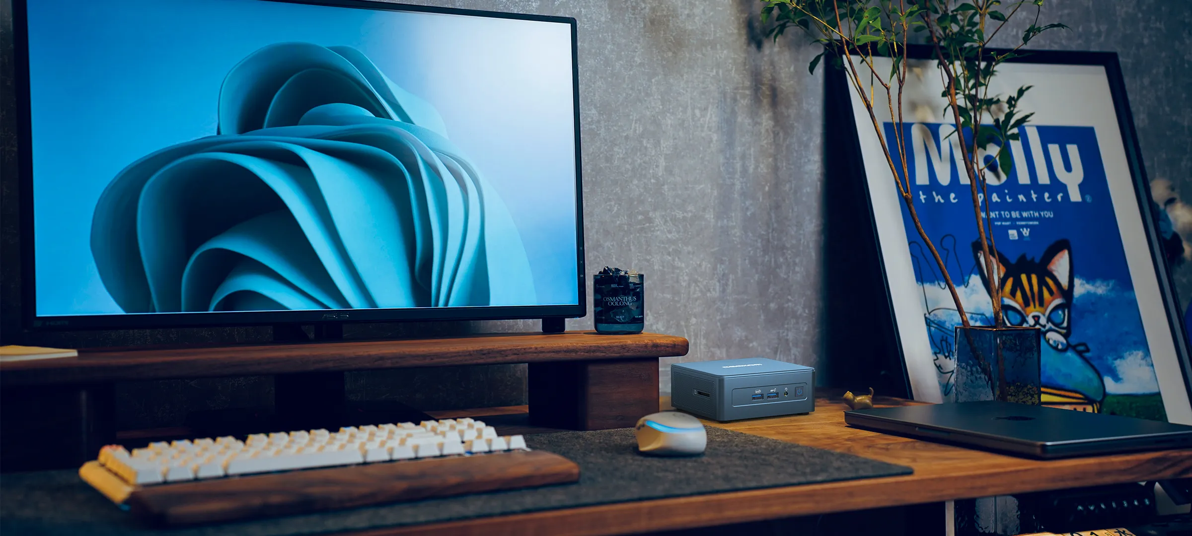Mini PC Windows 11, featuring AI support and professional video editing capabilities, placed on a modern desk with a keyboard, mouse, and laptop.